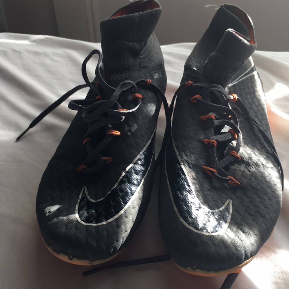 Gray and orange Nike hypervenom soccer cleats